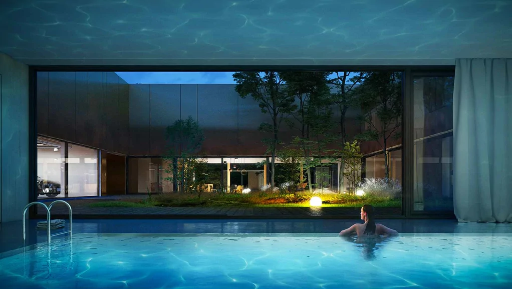 Wizualizacja wewnętrznego basenu z widokiem na zielone patio i nowoczesną zabudowę wokół dziedzińca nocą